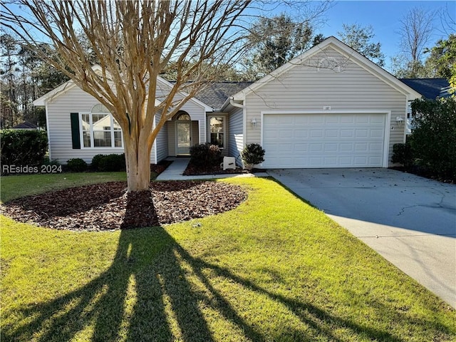 ranch-style home featuring a garage and a front yard