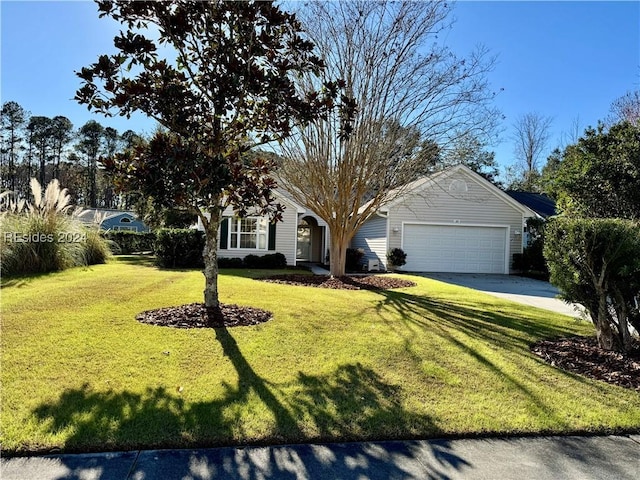 view of front of house featuring a garage and a front lawn