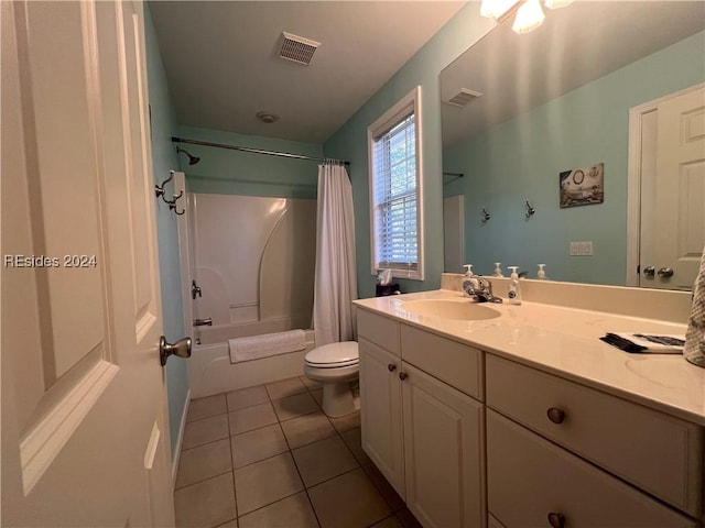 full bathroom featuring tile patterned flooring, vanity, toilet, and shower / bath combo with shower curtain