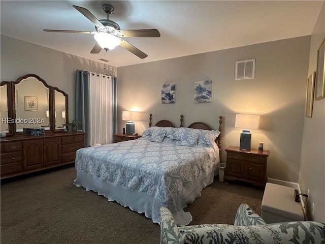 bedroom with ceiling fan and dark colored carpet