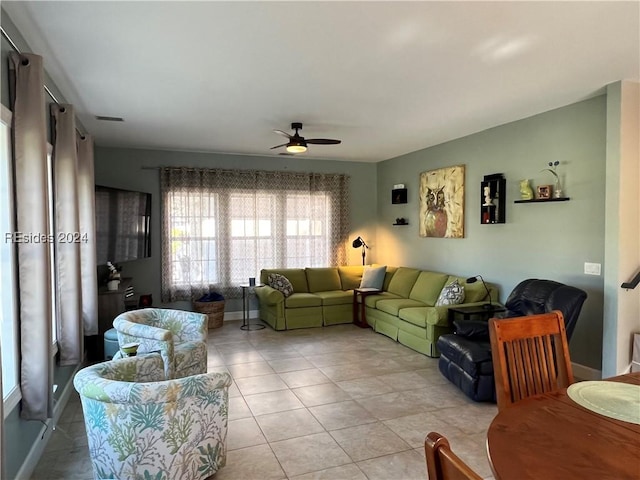 tiled living room featuring ceiling fan