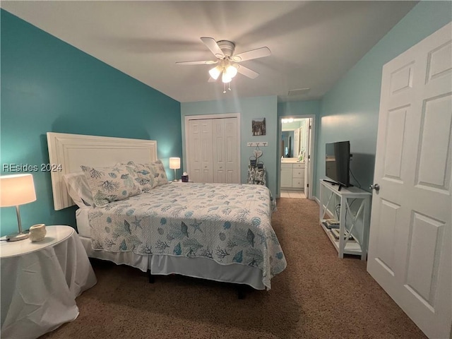 carpeted bedroom with ensuite bath, a closet, and ceiling fan