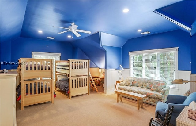 bedroom with ceiling fan, vaulted ceiling, and carpet