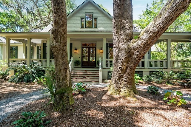 view of front of property featuring french doors and covered porch