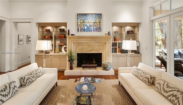 living room with hardwood / wood-style floors and a fireplace