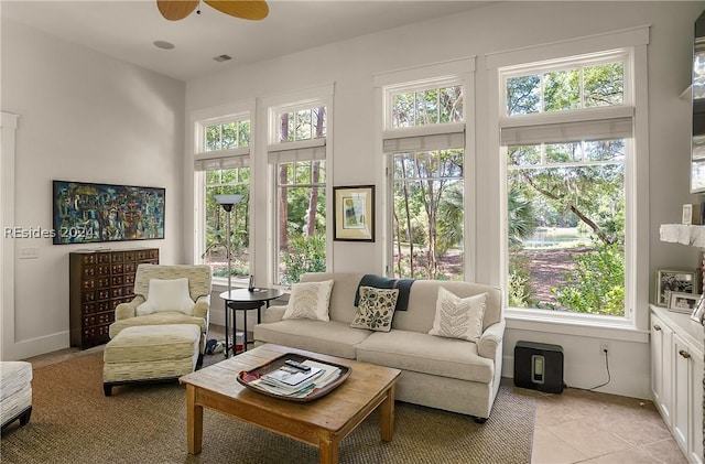 sunroom with ceiling fan and a wealth of natural light