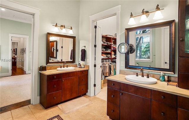 bathroom with tile patterned floors and vanity