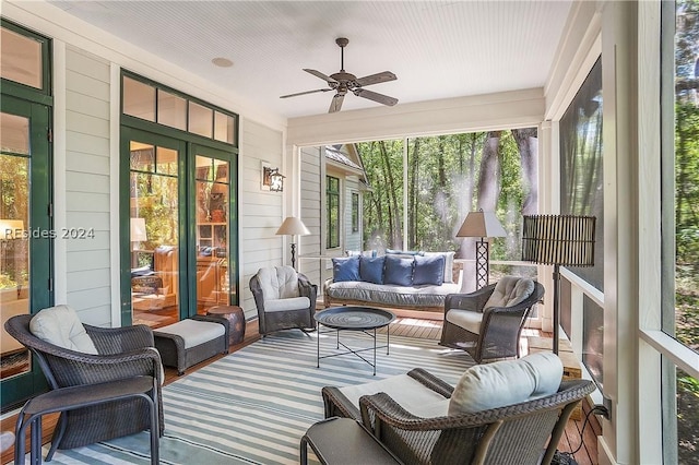 sunroom / solarium with ceiling fan