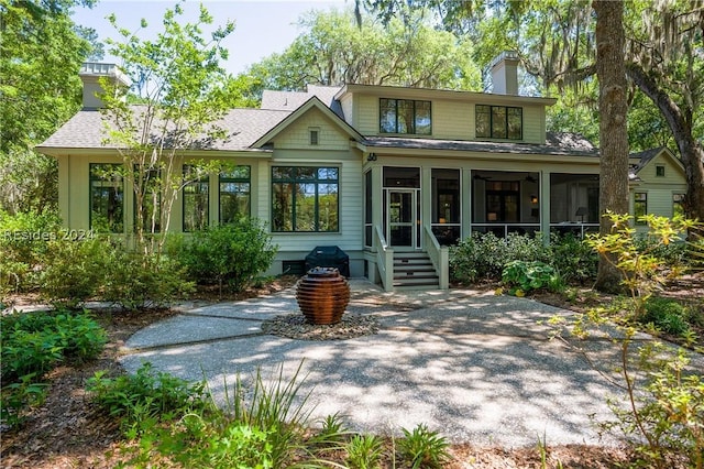 rear view of house with a sunroom