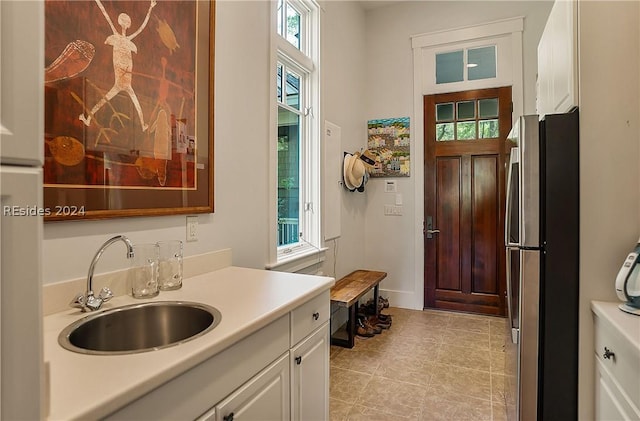 bathroom with vanity and plenty of natural light