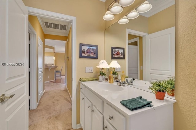 bathroom with vanity and crown molding