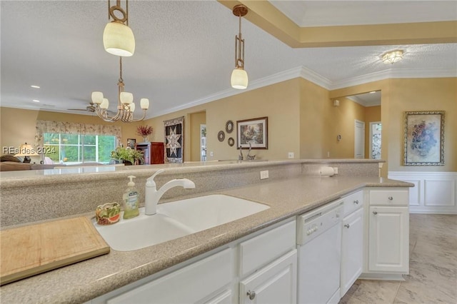 kitchen with sink, crown molding, hanging light fixtures, white dishwasher, and white cabinets