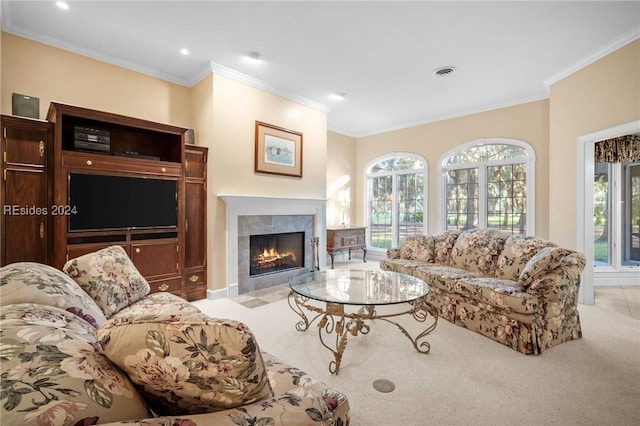 living room featuring light carpet, crown molding, and a tile fireplace