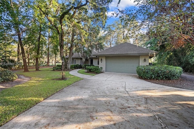 view of front of home with a garage and a front yard