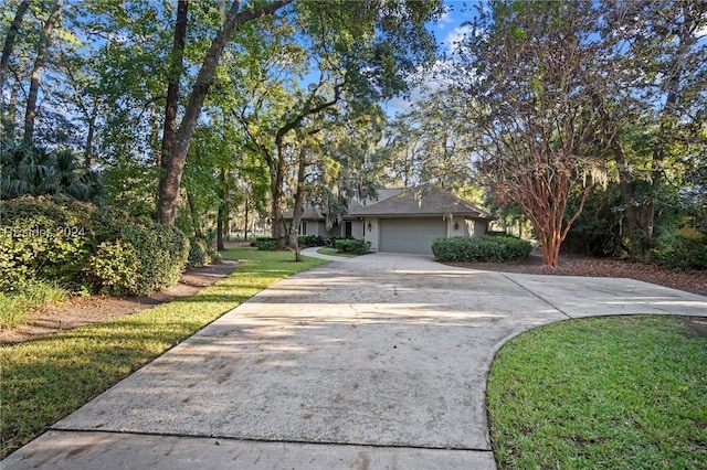 view of front facade with a garage and a front yard