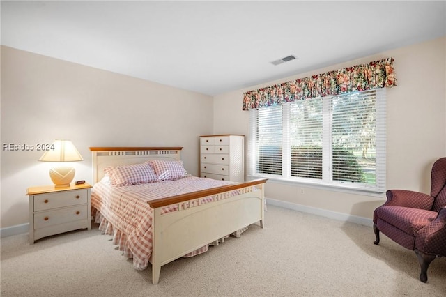 bedroom with light colored carpet