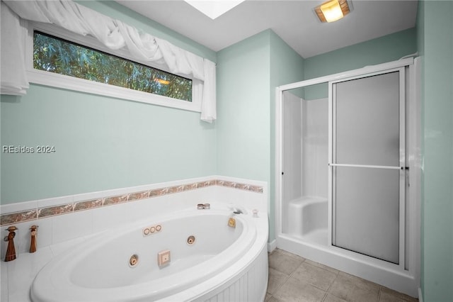 bathroom featuring tile patterned flooring and plus walk in shower