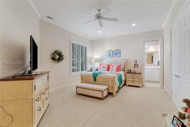 bedroom with crown molding, light carpet, connected bathroom, and ceiling fan