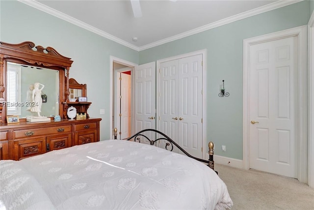 carpeted bedroom featuring crown molding and ceiling fan