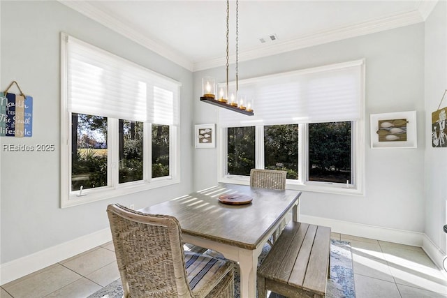 dining space featuring light tile patterned flooring, an inviting chandelier, and crown molding