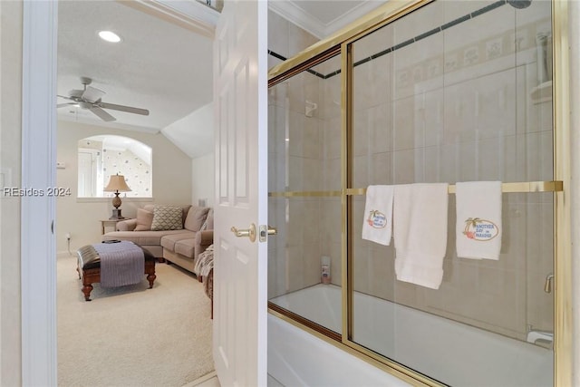 bathroom featuring vaulted ceiling, ornamental molding, ceiling fan, and shower / bath combination with glass door