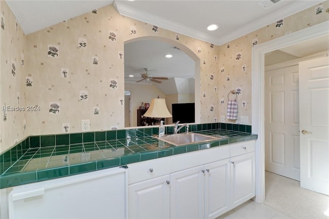 bathroom with ornamental molding, tile patterned floors, ceiling fan, and vanity