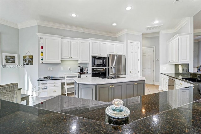 kitchen with white cabinetry, a center island, sink, and black appliances