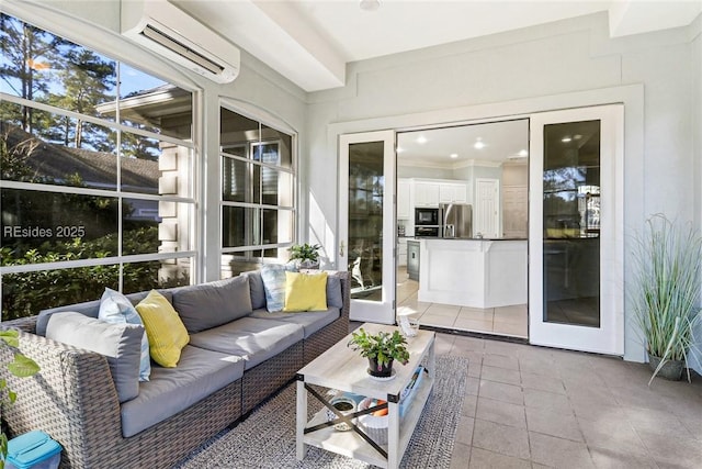 sunroom / solarium featuring a wall unit AC