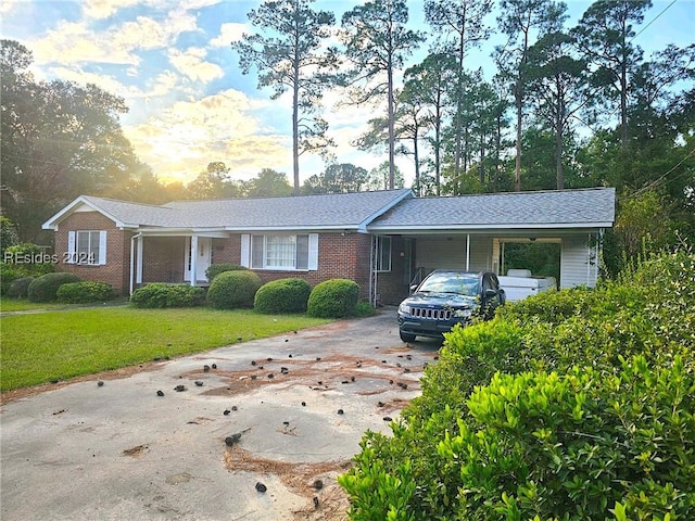 single story home with a carport and a lawn