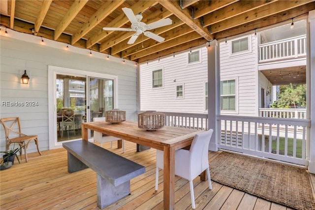 wooden deck featuring ceiling fan