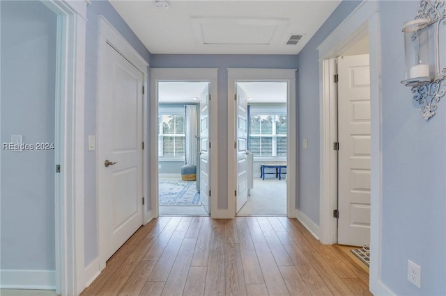 hallway featuring light wood-type flooring