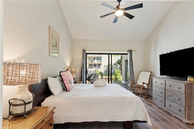 bedroom featuring hardwood / wood-style floors, vaulted ceiling, access to outside, and ceiling fan