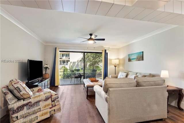 living room featuring crown molding, dark wood-type flooring, and ceiling fan