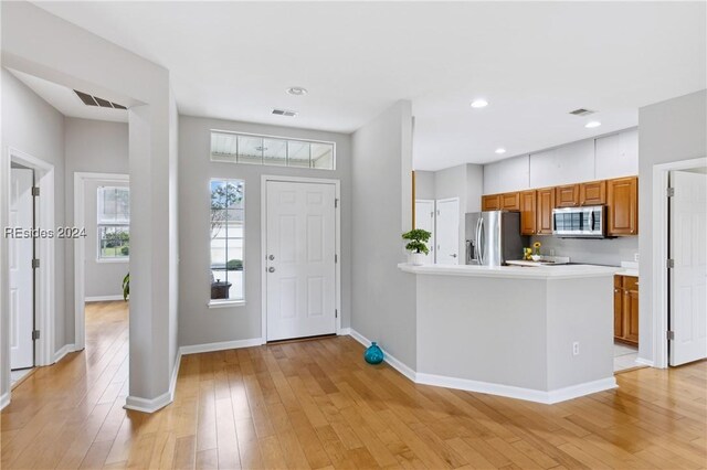 interior space featuring light hardwood / wood-style flooring and appliances with stainless steel finishes