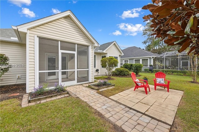 view of patio featuring a sunroom