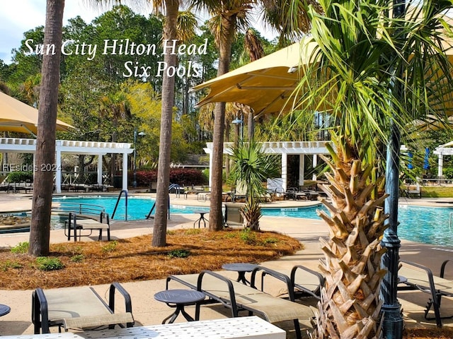 view of pool featuring a pergola and a patio area