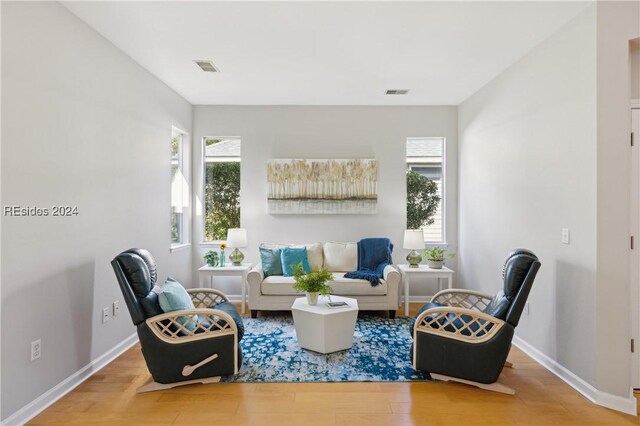 sitting room featuring hardwood / wood-style flooring