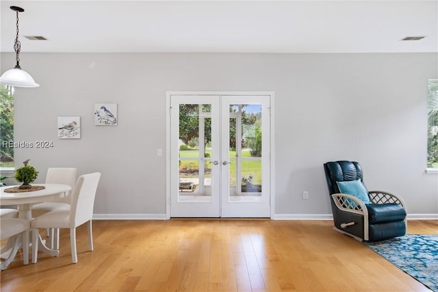 interior space featuring french doors and hardwood / wood-style floors