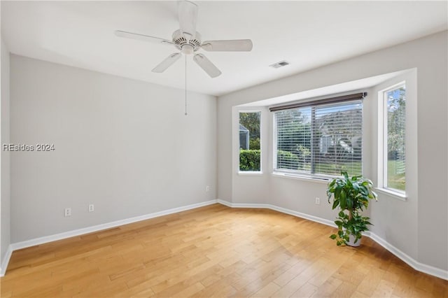 unfurnished room featuring ceiling fan and light hardwood / wood-style floors