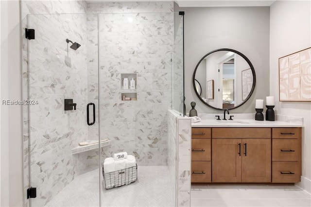 bathroom featuring vanity and a shower with door