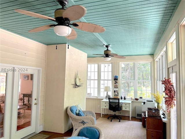 sunroom / solarium featuring wood ceiling