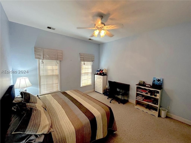 carpeted bedroom with ceiling fan