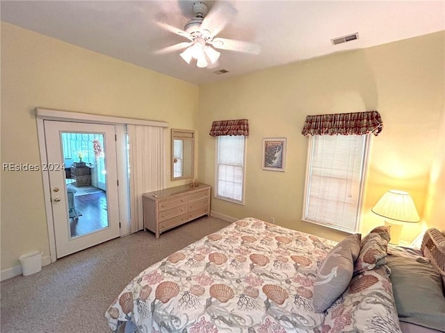 bedroom with ceiling fan, access to exterior, and light colored carpet