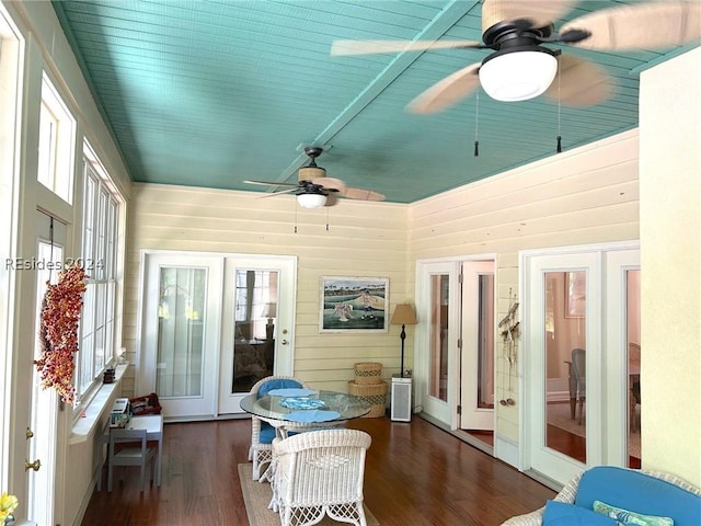 sunroom / solarium featuring french doors and ceiling fan