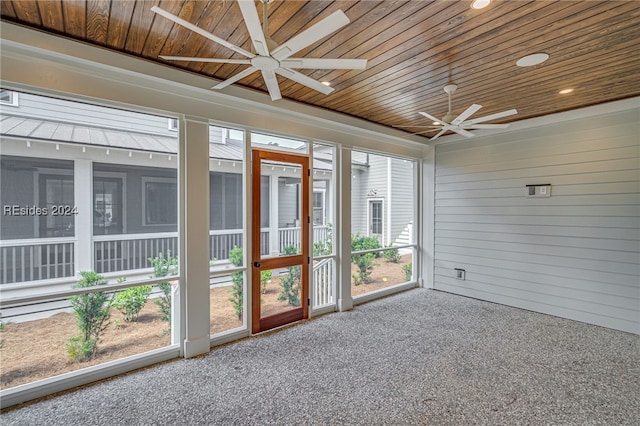 unfurnished sunroom with wooden ceiling and ceiling fan