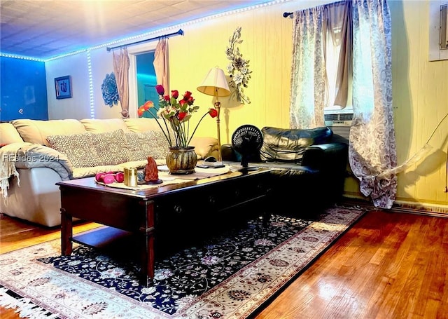 living room with crown molding, hardwood / wood-style floors, and cooling unit