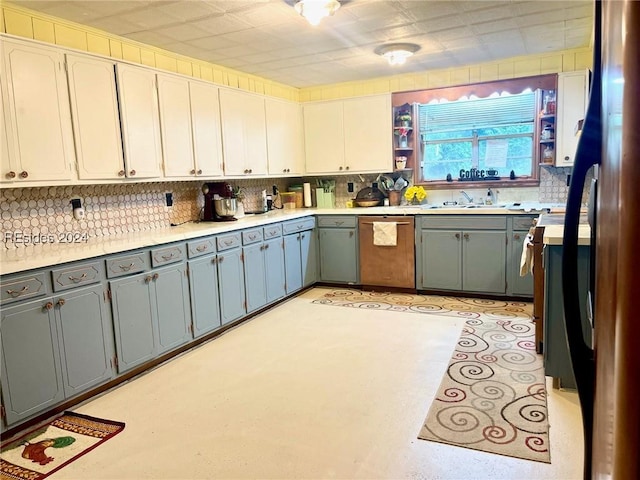 kitchen with white cabinetry, sink, stainless steel dishwasher, and gray cabinetry