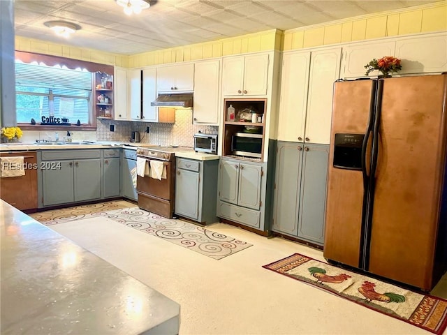 kitchen with white cabinetry, sink, gray cabinets, and stainless steel appliances