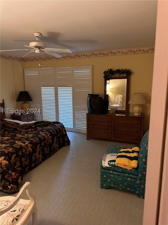 carpeted bedroom featuring ceiling fan