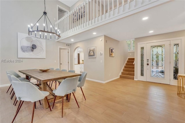 dining space featuring a chandelier and light hardwood / wood-style floors